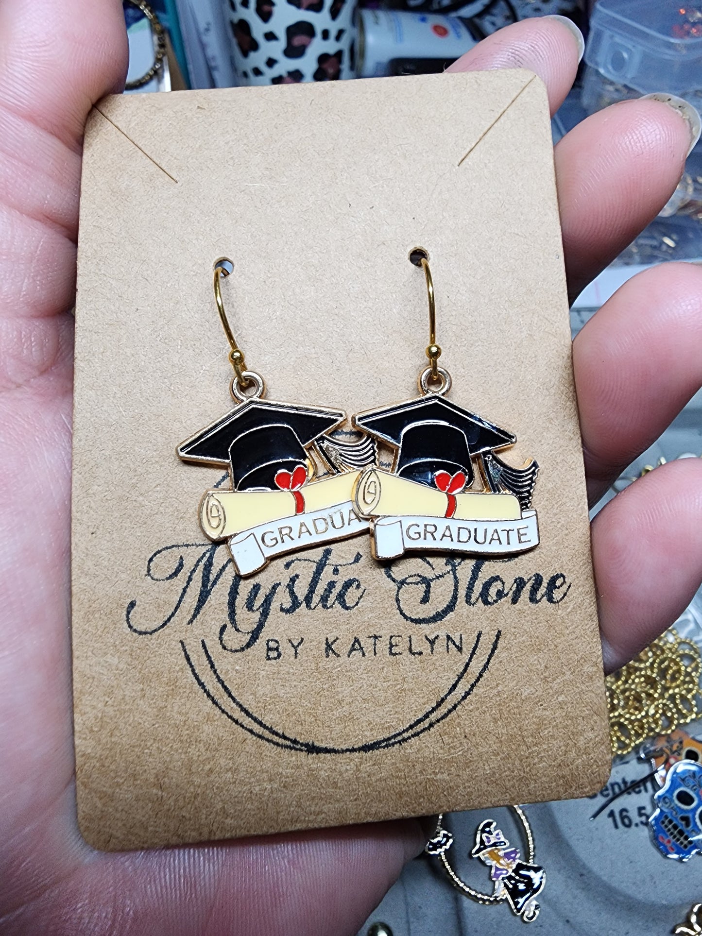 Gold plated graduation charm style earrings