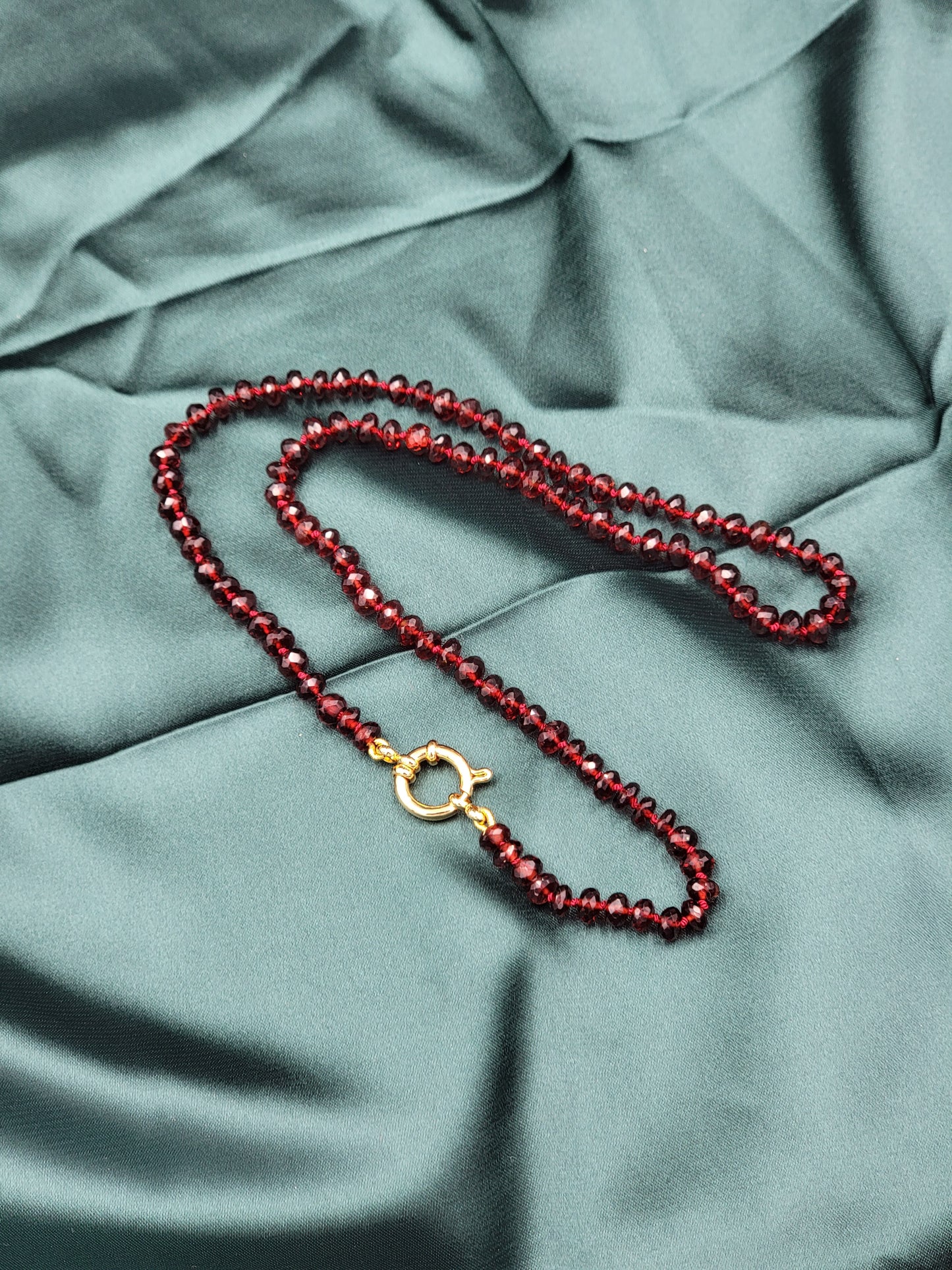 Hand-knotted silk Mozambique Garnet necklace with 24k gold filled clasp.