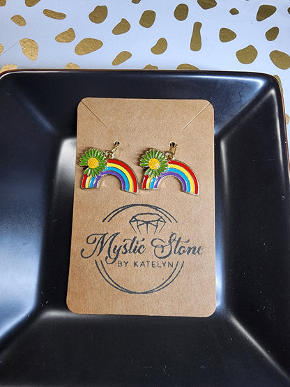 Gold plated rainbow charm style earrings with green daisy